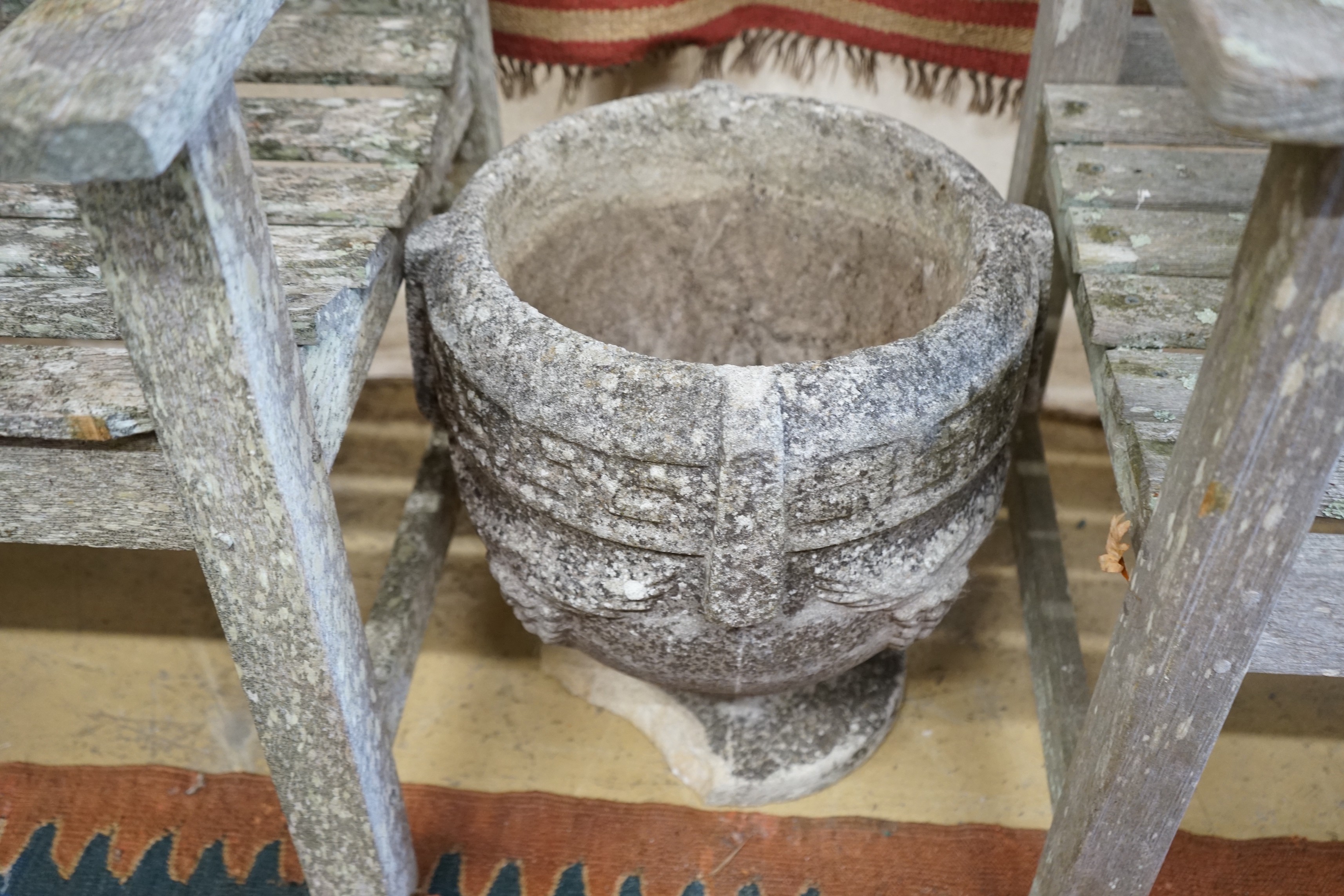 Three circular reconstituted stone garden planters, largest diameter 40cm, height 32cm